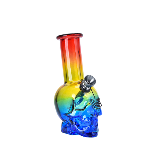 Colorful glass skull-shaped water pipe with rainbow gradient on a white background